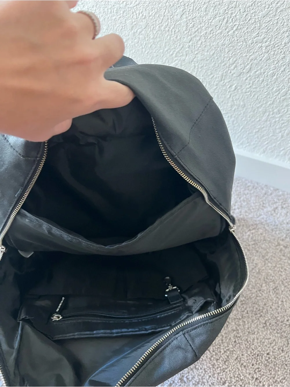 Black diaper backpack by The Honest Company